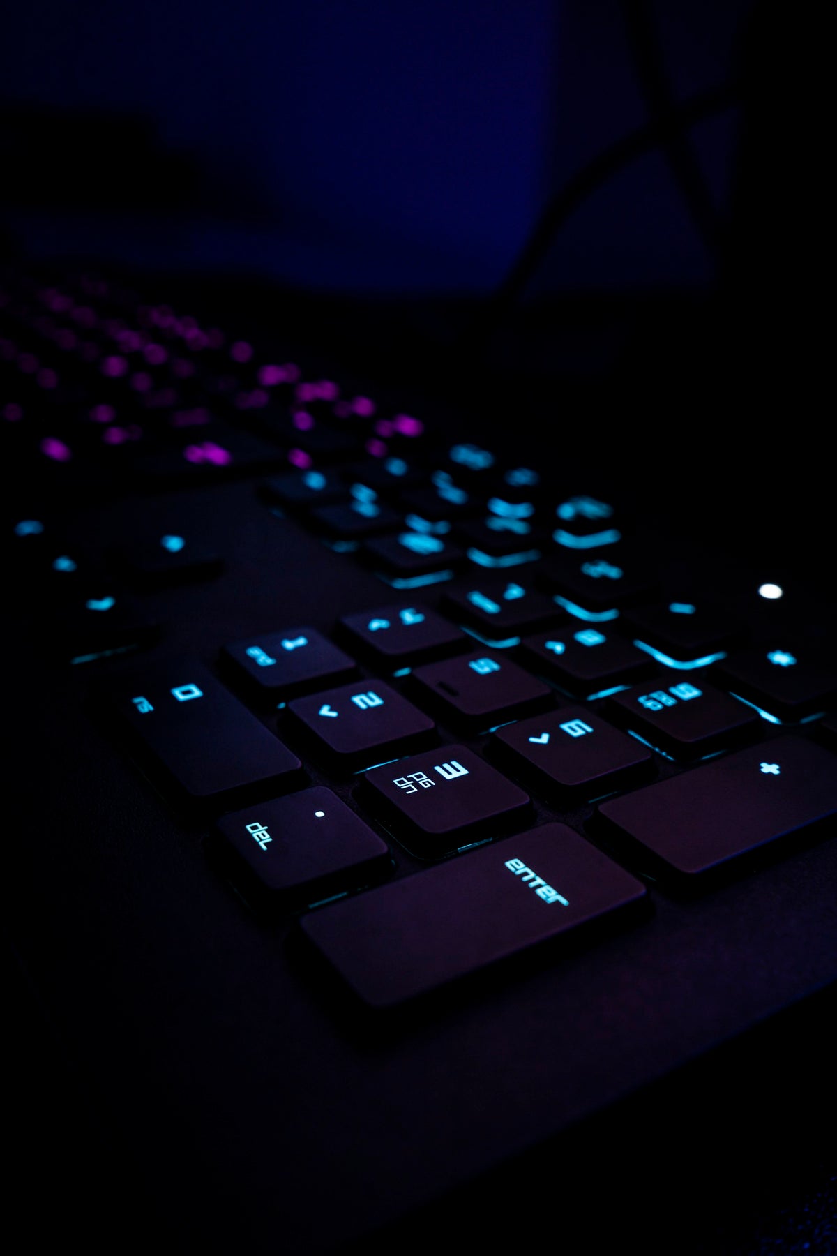 Atlas keyboard resting on blue fabric